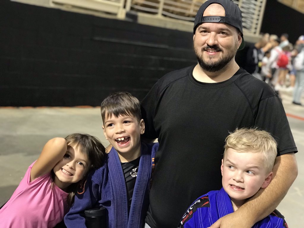The family behind Stonebelt, a Canadian BJJ gear brand, wearing jiu-jitsu gis at the academy