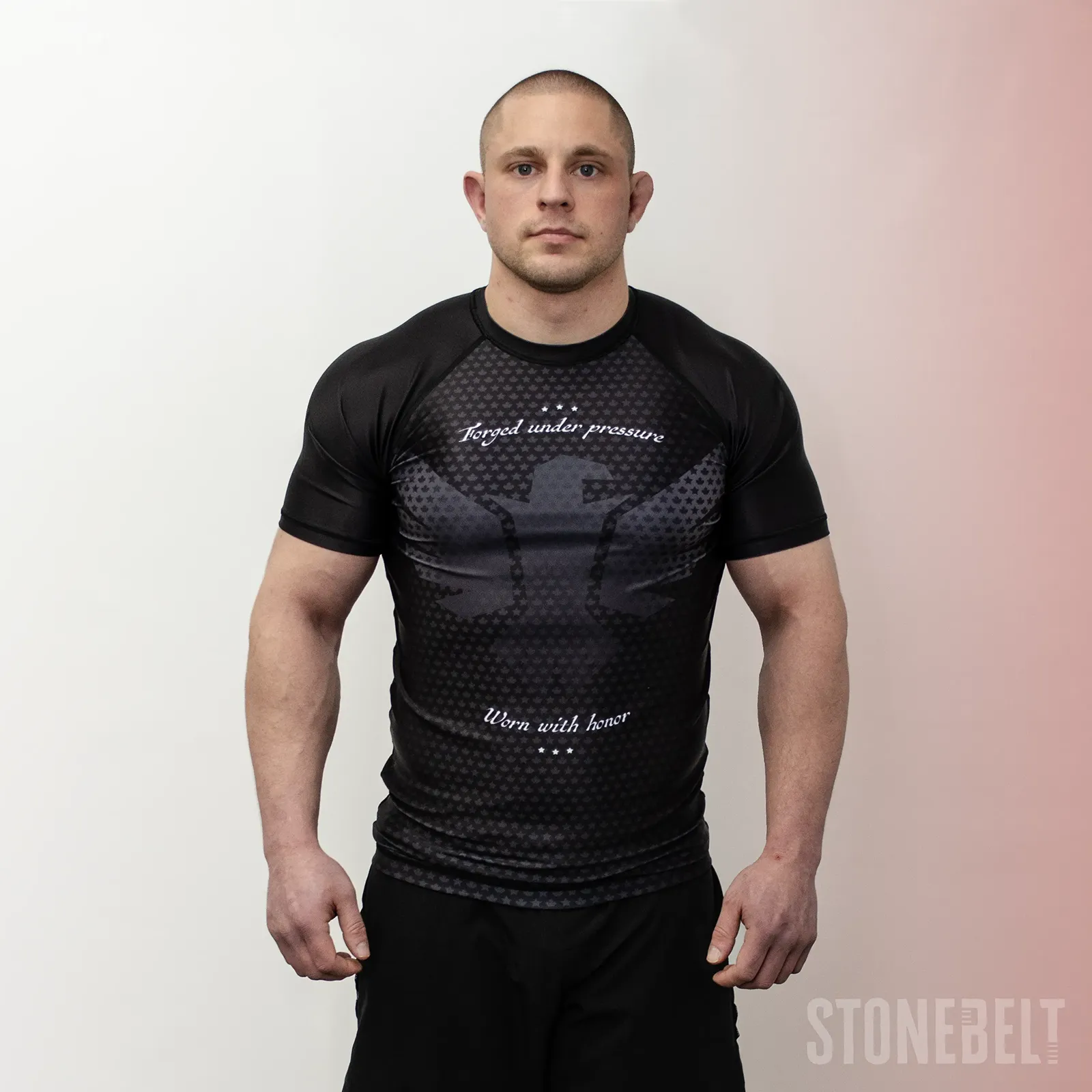 Athlete wearing Stonebelt Legion short sleeve BJJ rashguard in black with sublimated eagle design