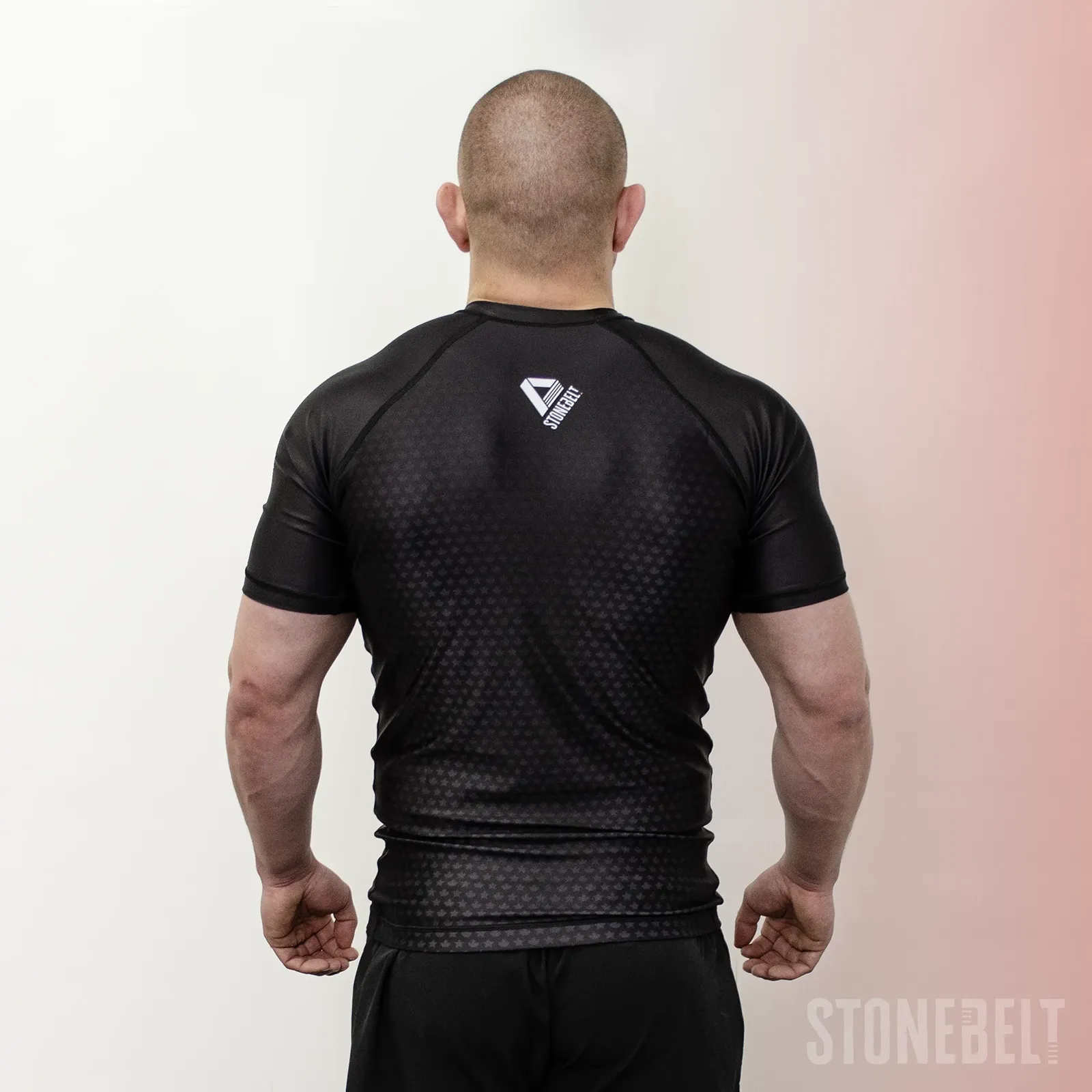 Back view of Stonebelt Legion short sleeve rashguard with Stonebelt logo and raglan seam detail