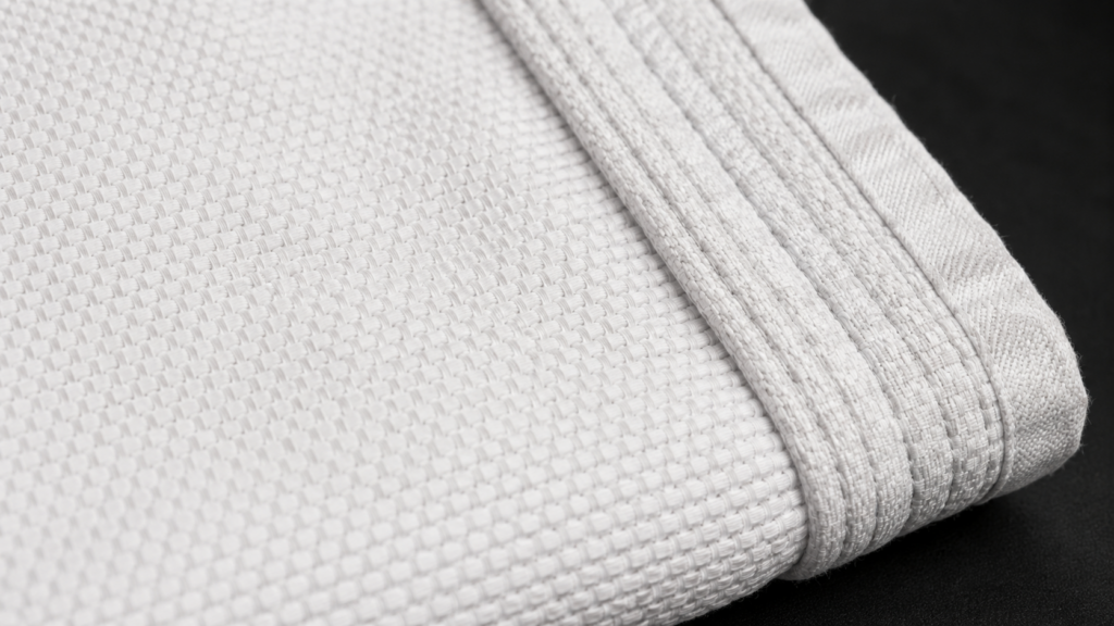 Close up BJJ jacket in single weave pattern