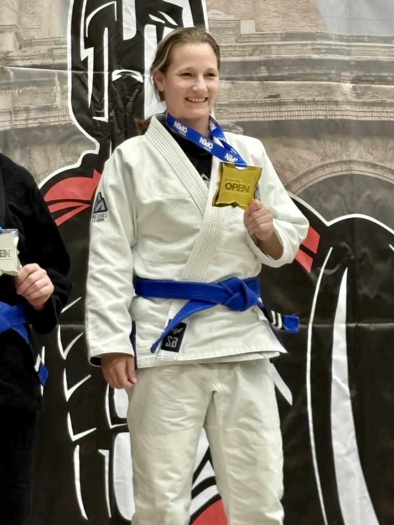 Brazilian Jiu-Jitsu competitor wearing a Stonebelt Heritage Gi with a medal