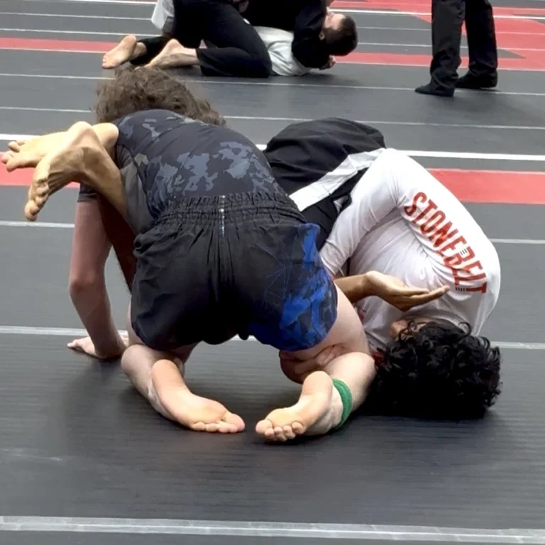 Brazilian Jiu-Jitsu athlete competing in a Stonebelt rashguard